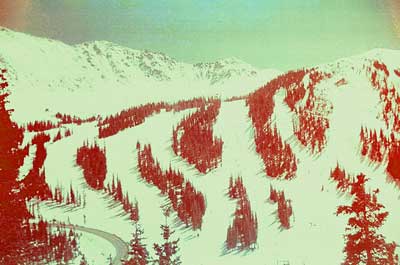 A photograph from a roll of film found in an camera from an estate. The image is an unknown ski resort from the late 1970s to early 1980s. The photograph is reminiscent of a Japanese Wood Block print. 