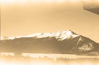 A photograph from a roll of film found in an camera from an estate. The image is an unknown ski resort from the late 1970s to early 1980s. The photograph is reminiscent of a Japanese Wood Block print. 