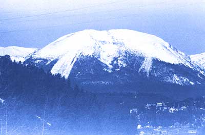 A photograph from a roll of film found in an camera from an estate. The image is an unknown ski resort from the late 1970s to early 1980s. The photograph is reminiscent of a Japanese Wood Block print. 